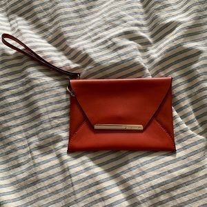 BCBG MAX AZRIA burnt orange and gold wristlet - EUC